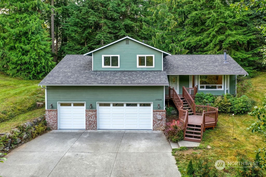 11026 Trombley Road Snohomish, WA 98290 - Photo 1 of 30 a front view of a house with a yard and garage