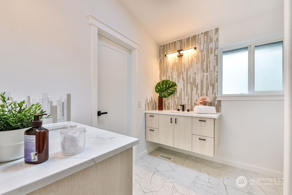11026 Trombley Road Snohomish, WA 98290 - Photo 16 of 30 a bathroom with a sink a vanity and mirror