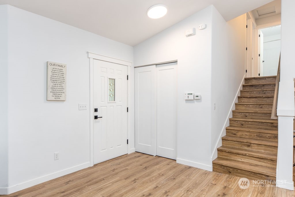 11026 Trombley Road Snohomish, WA 98290 - Photo 20 of 30 a view of a hallway with wooden floor and entryway
