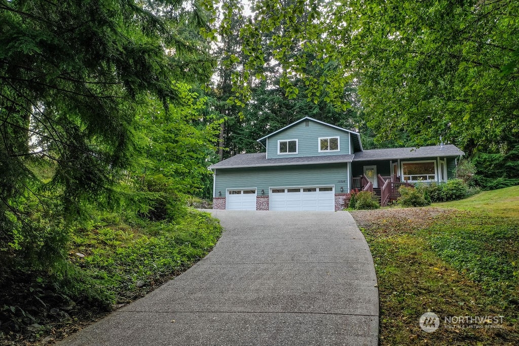 11026 Trombley Road Snohomish, WA 98290 - Photo 29 of 30 front view of a house with a yard