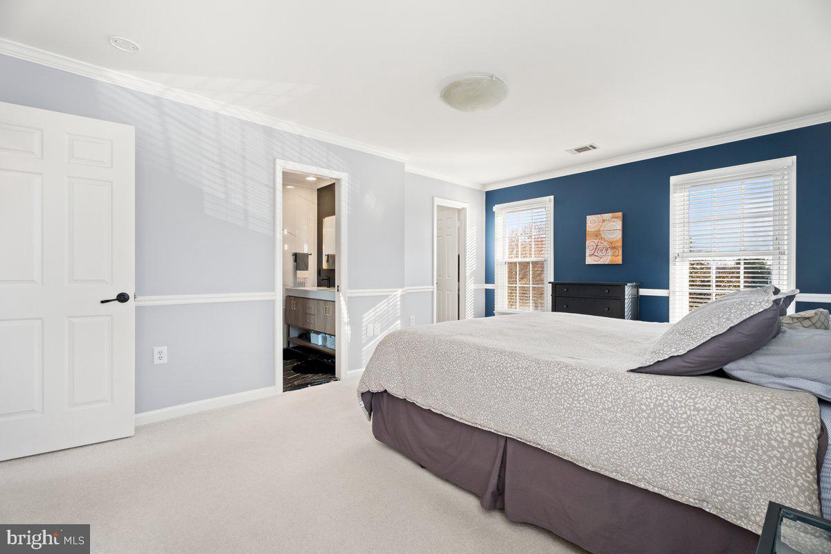 13534 King Charles Drive Chantilly, VA 20151 - Photo 14 of 28 a bedroom with a large bed and dresser