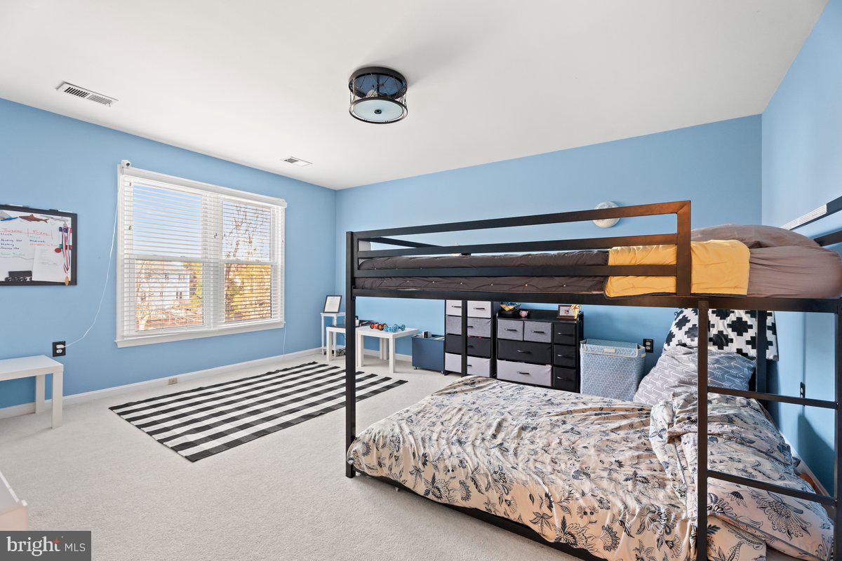 13534 King Charles Drive Chantilly, VA 20151 - Photo 17 of 28 a bedroom with a bed and a window