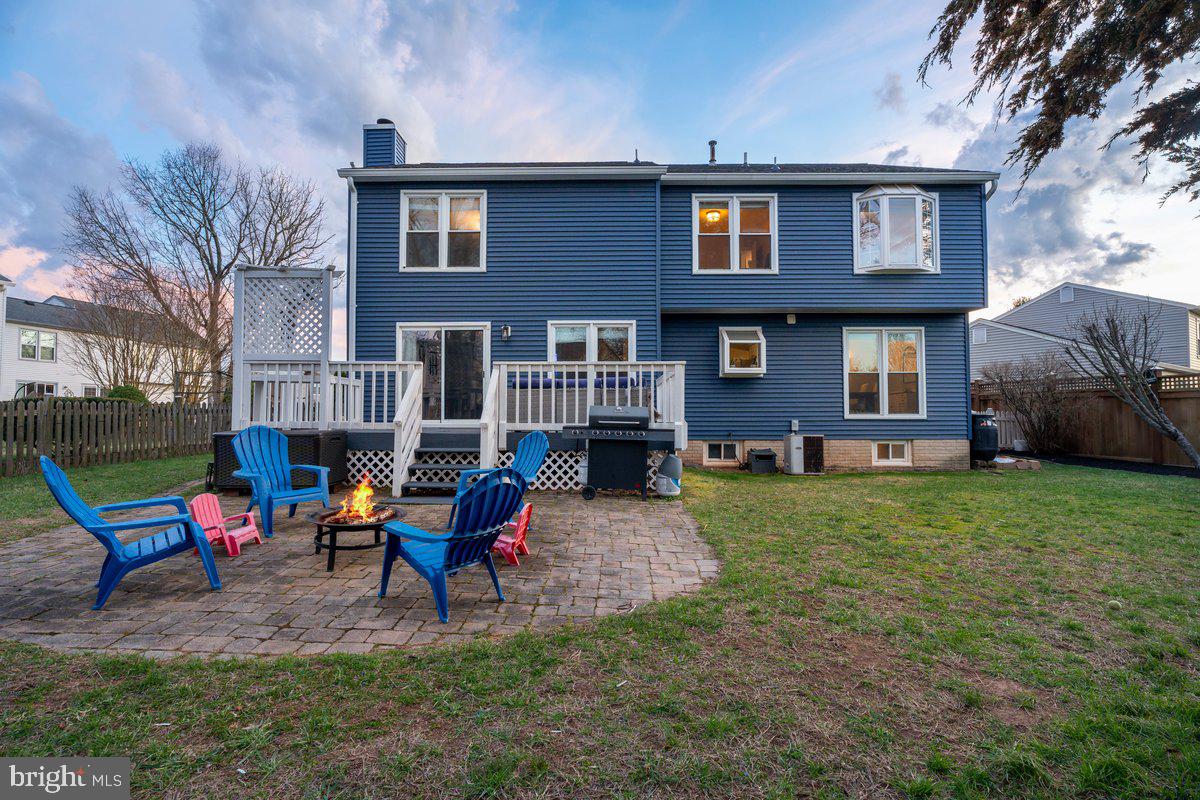 13534 King Charles Drive Chantilly, VA 20151 - Photo 22 of 28 a view of backyard of house with outdoor seating