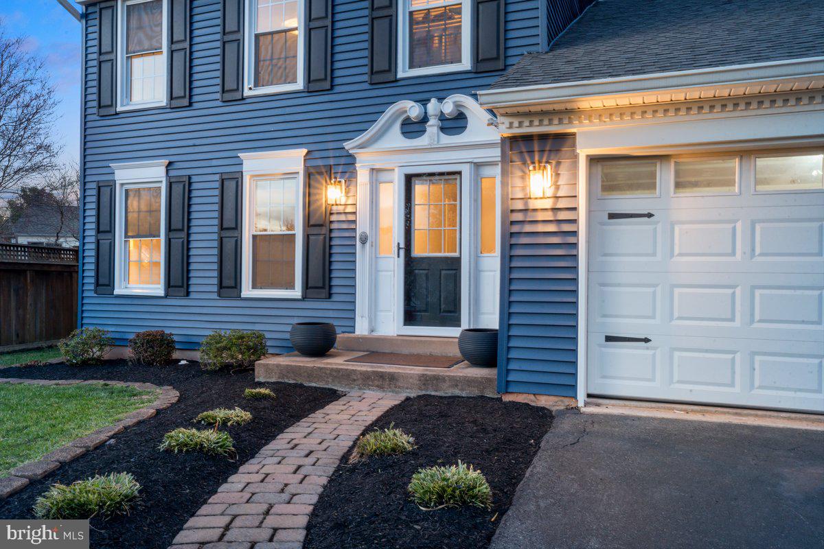13534 King Charles Drive Chantilly, VA 20151 - Photo 10 of 28 a front view of a house with a yard