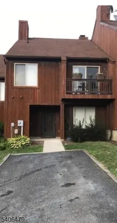 a view of a house with a street