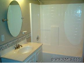 398 Dewitt Owens Road Rutherfordton, NC 28139 - Photo 11 of 12 a bathroom with a sink and a mirror