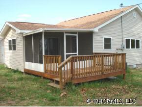 398 Dewitt Owens Road Rutherfordton, NC 28139 - Photo 4 of 12 a view of a house with a yard and deck