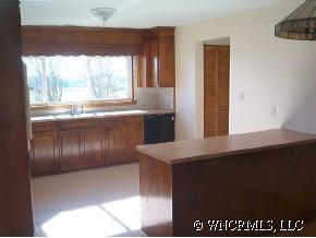 398 Dewitt Owens Road Rutherfordton, NC 28139 - Photo 8 of 12 a view of kitchen with granite countertop stainless steel appliances a sink and a counter