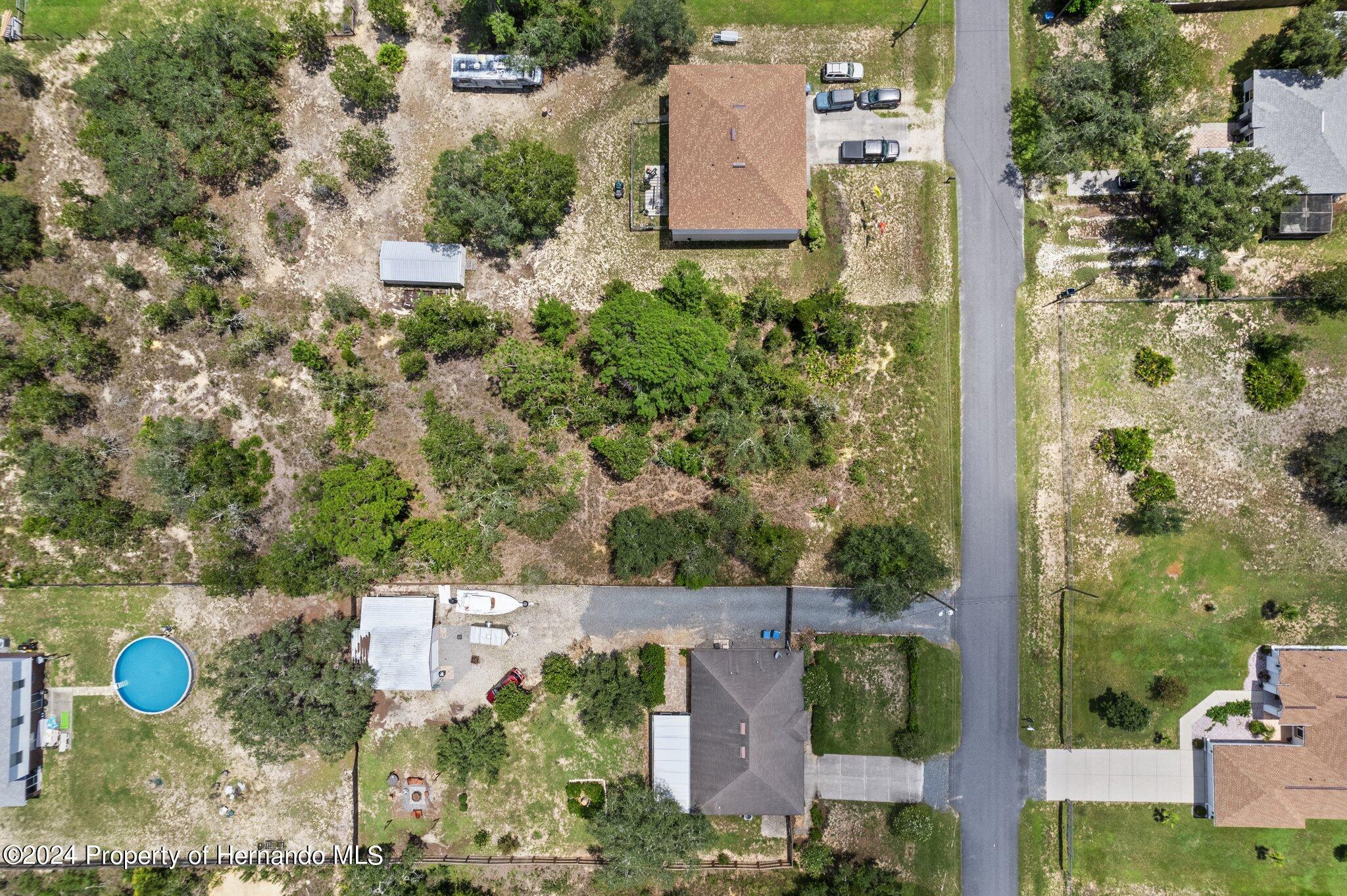 0 House Finch Road Weeki Wachee, FL 34614 - Photo 11 of 13 an aerial view of a house with outdoor space