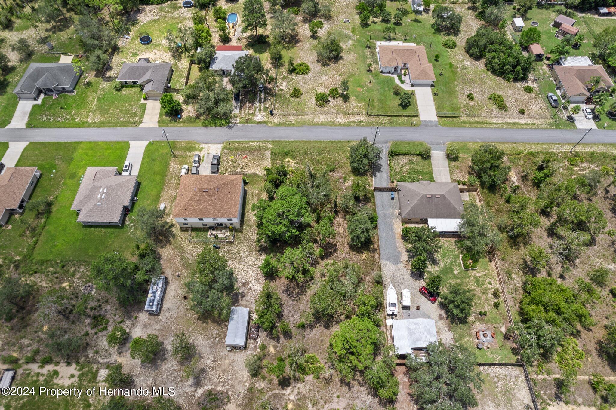 0 House Finch Road Weeki Wachee, FL 34614 - Photo 7 of 13 an aerial view of house with a yard
