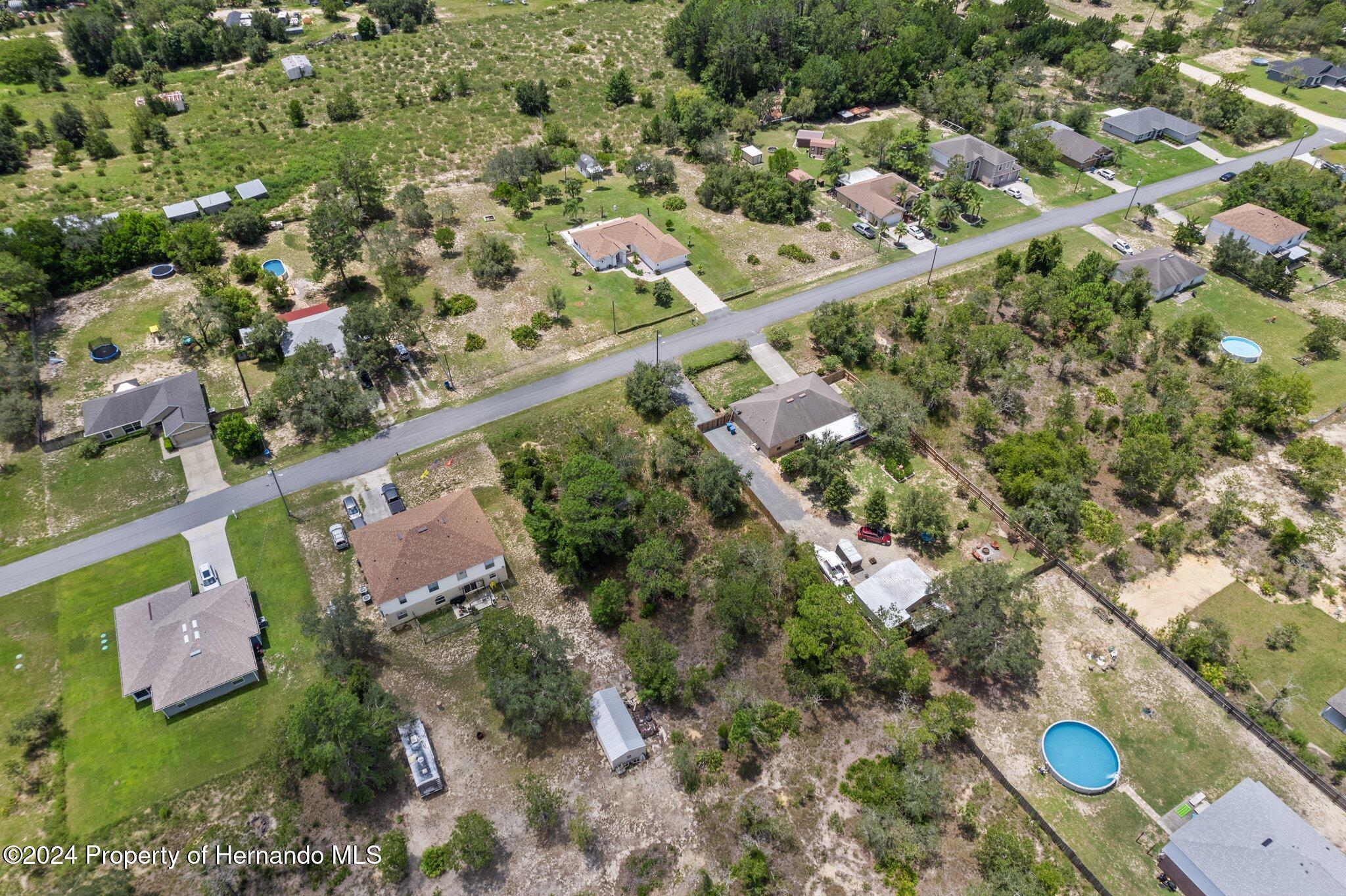 0 House Finch Road Weeki Wachee, FL 34614 - Photo 8 of 13 an aerial view of a city