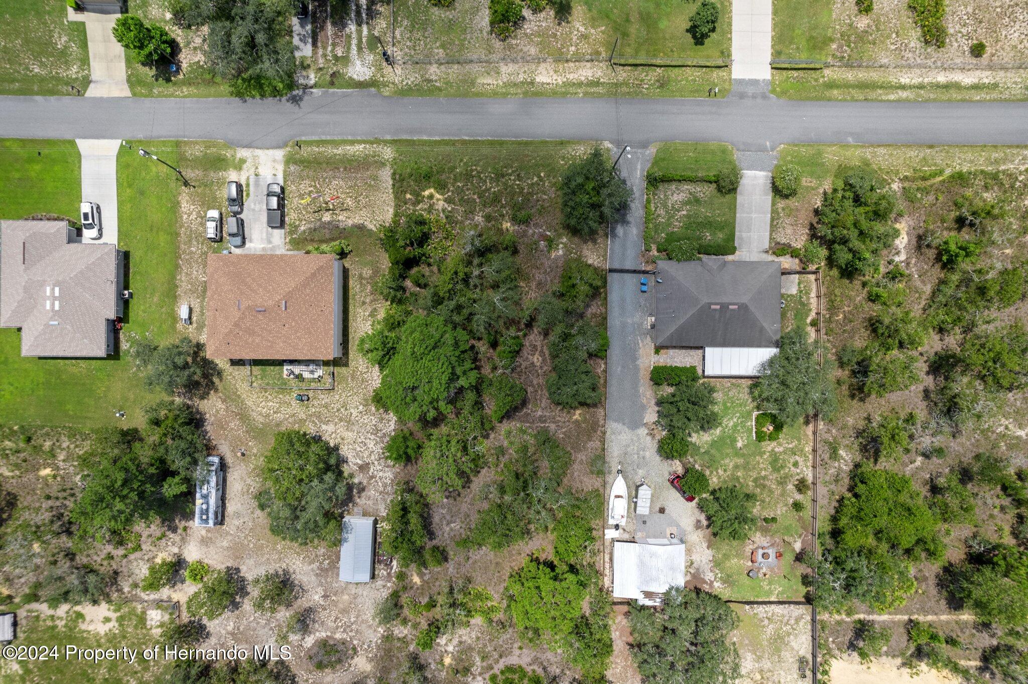 0 House Finch Road Weeki Wachee, FL 34614 - Photo 9 of 13 an aerial view of a house with a yard