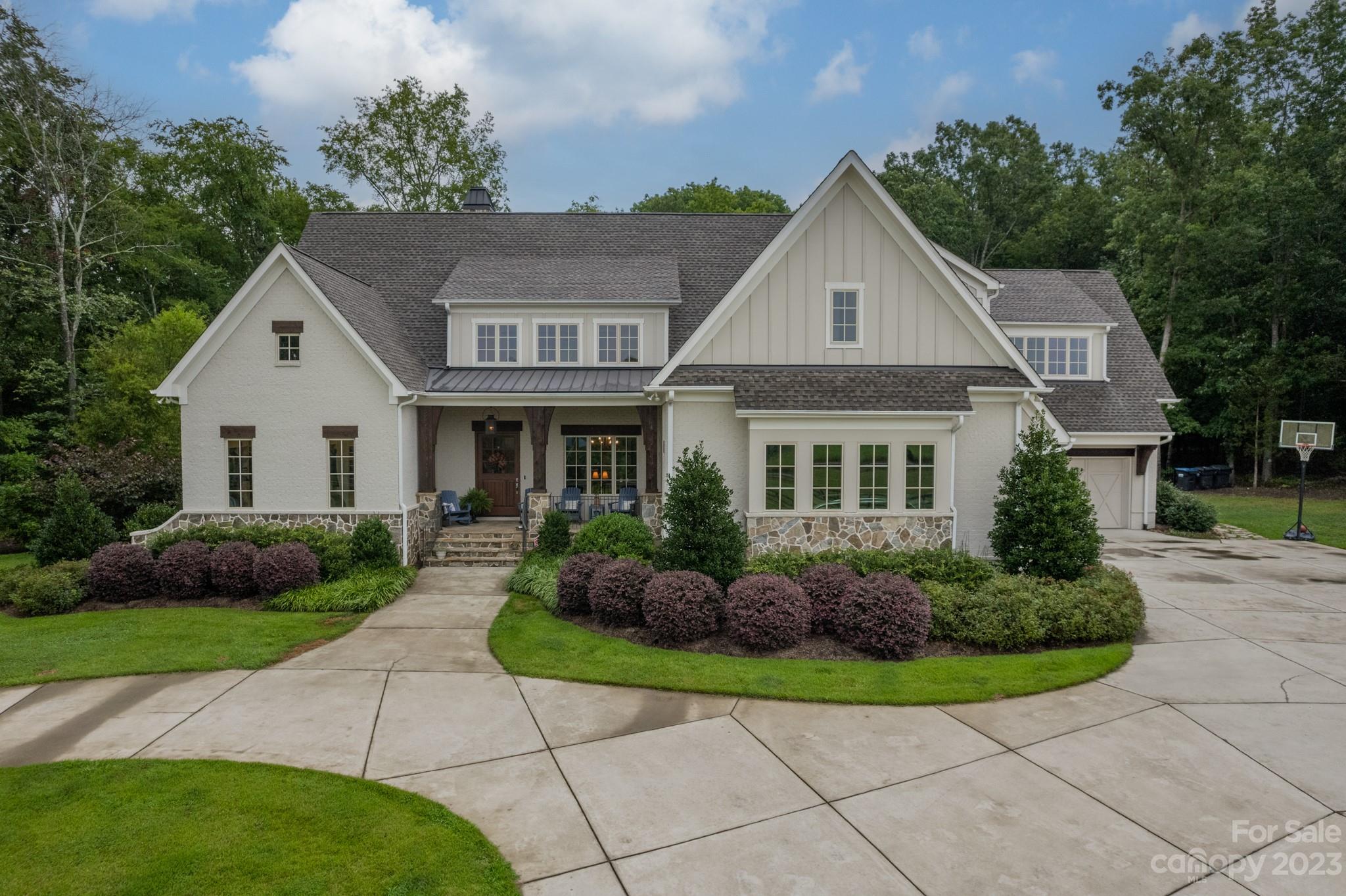 721 Lester Davis Road Waxhaw, NC 28173 - Photo 1 of 48 a front view of a house with a yard and potted plants