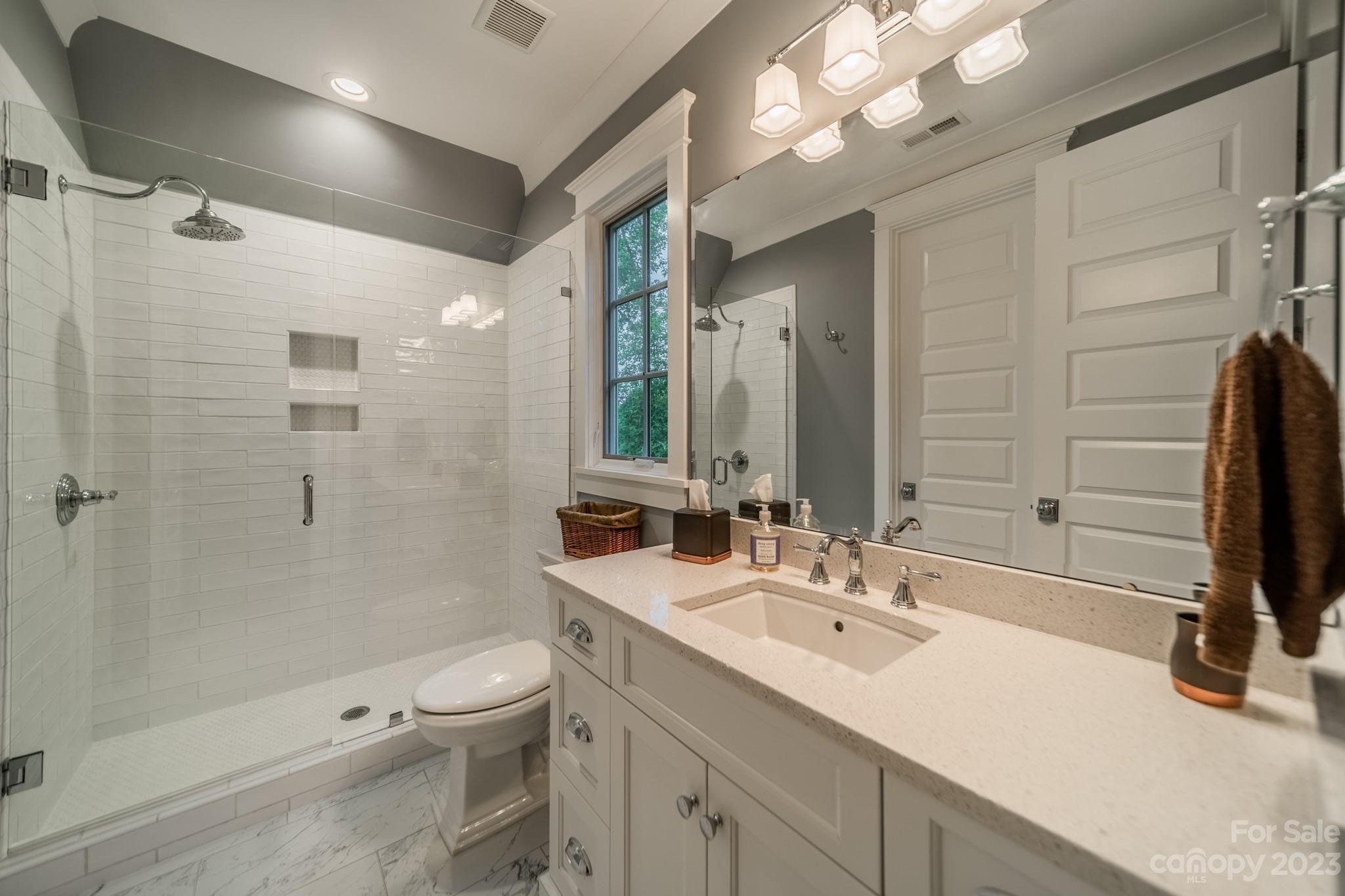 721 Lester Davis Road Waxhaw, NC 28173 - Photo 11 of 48 a bathroom with a sink double vanity granite toilet and shower