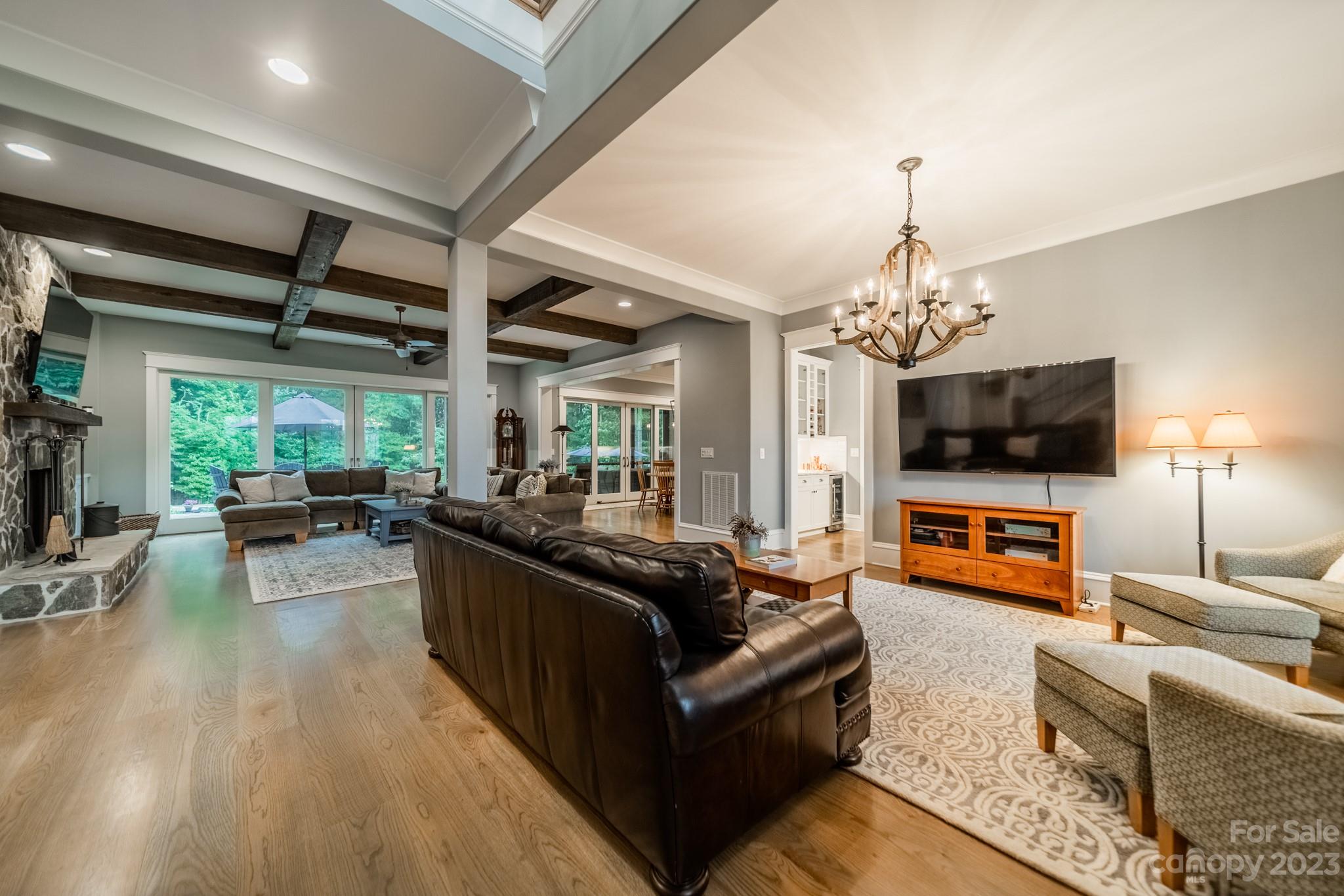 721 Lester Davis Road Waxhaw, NC 28173 - Photo 15 of 48 a living room with furniture and a flat screen tv