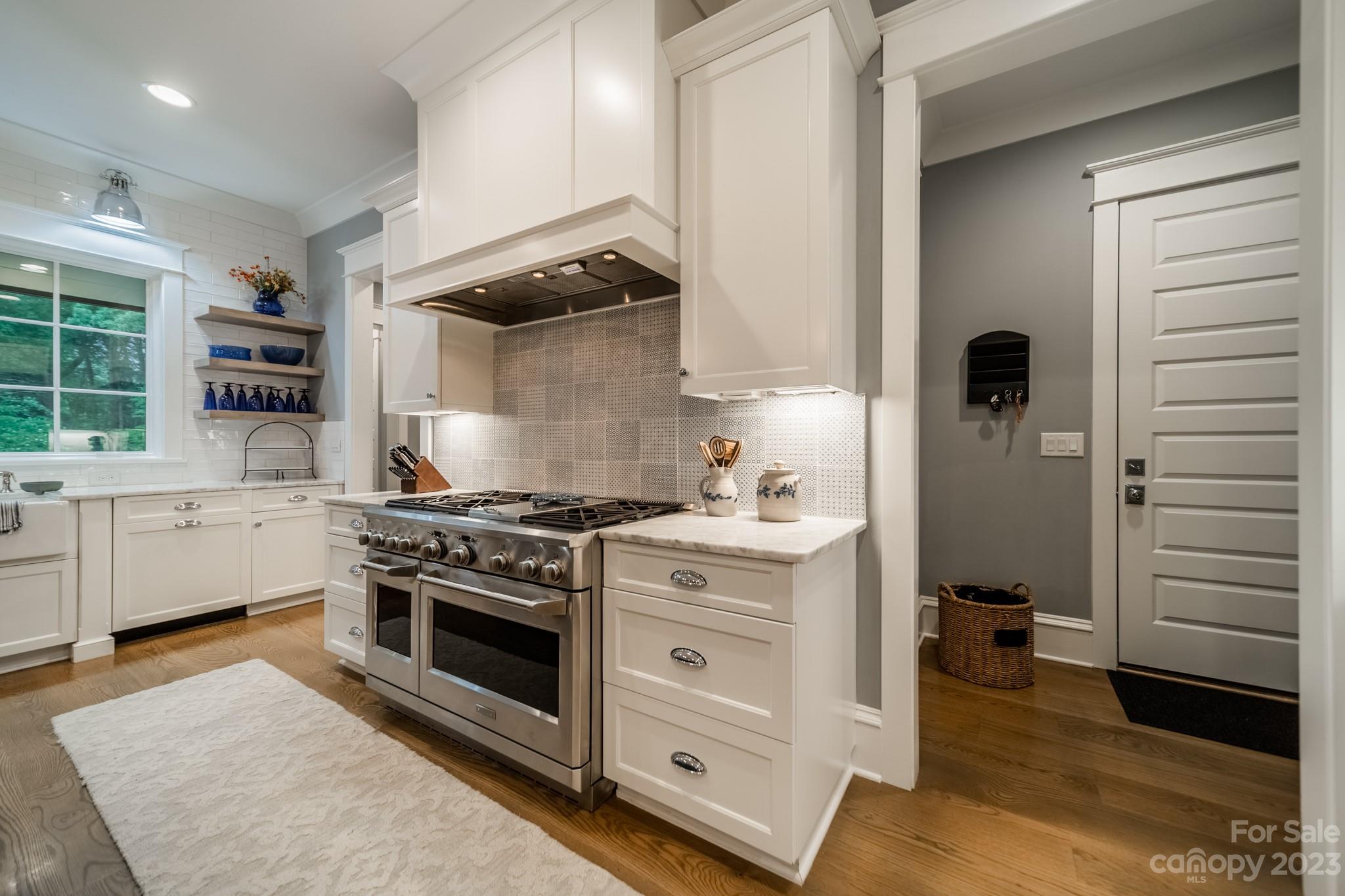 721 Lester Davis Road Waxhaw, NC 28173 - Photo 23 of 48 a kitchen with a stove and a sink