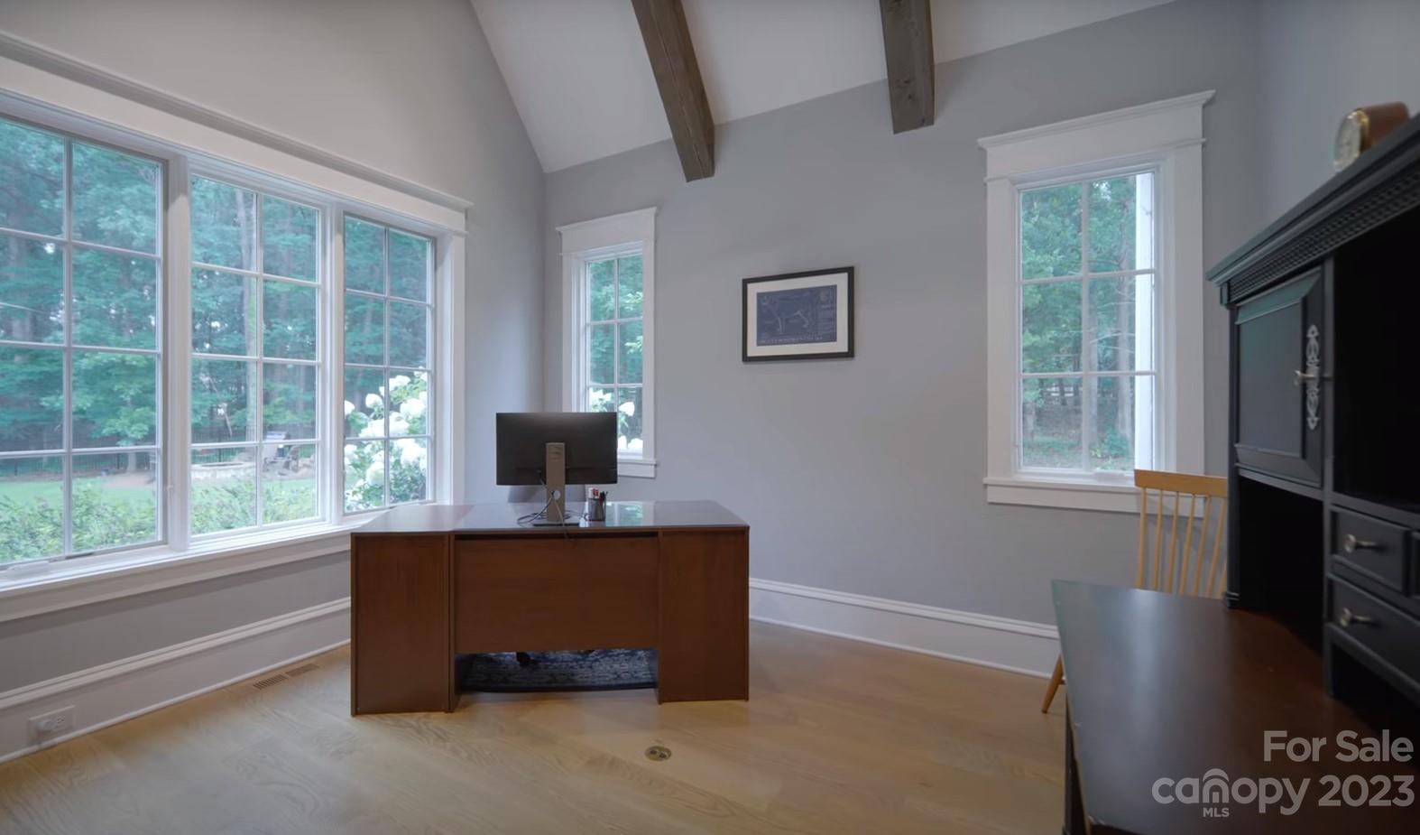 721 Lester Davis Road Waxhaw, NC 28173 - Photo 25 of 48 a living room with a large window and a flat screen tv