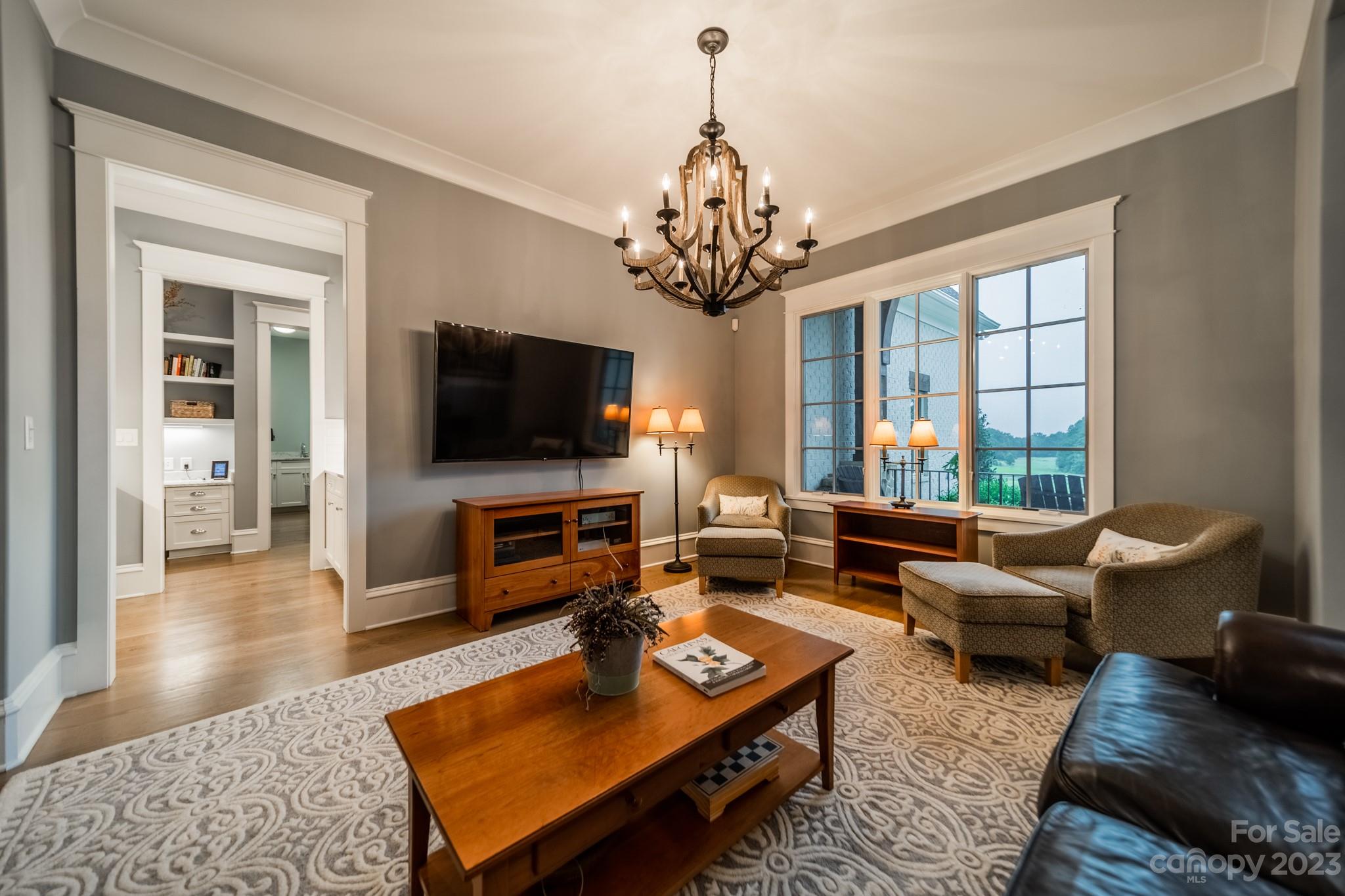 721 Lester Davis Road Waxhaw, NC 28173 - Photo 3 of 48 a living room with furniture and a flat screen tv