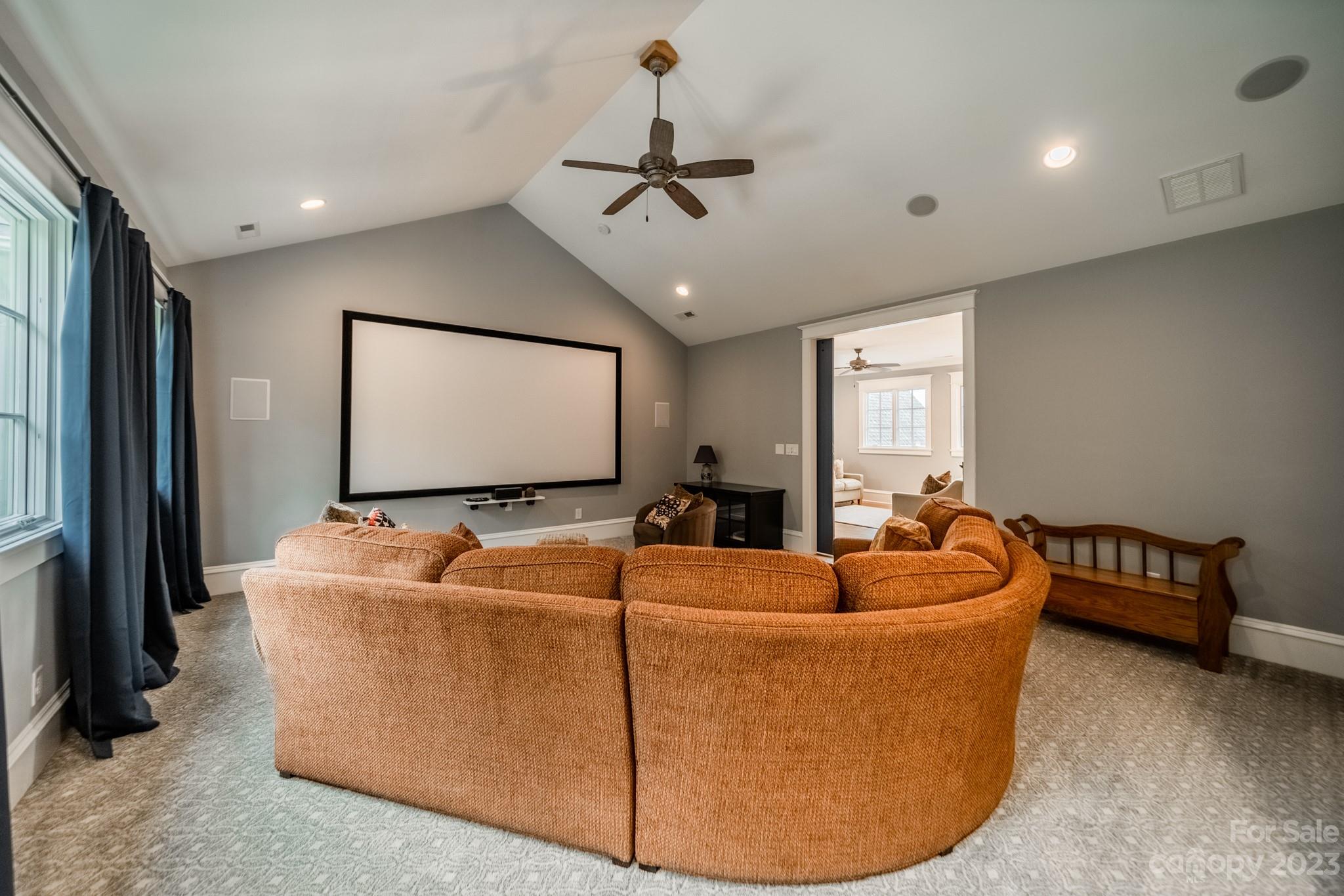 721 Lester Davis Road Waxhaw, NC 28173 - Photo 33 of 48 a living room with furniture and a flat screen tv