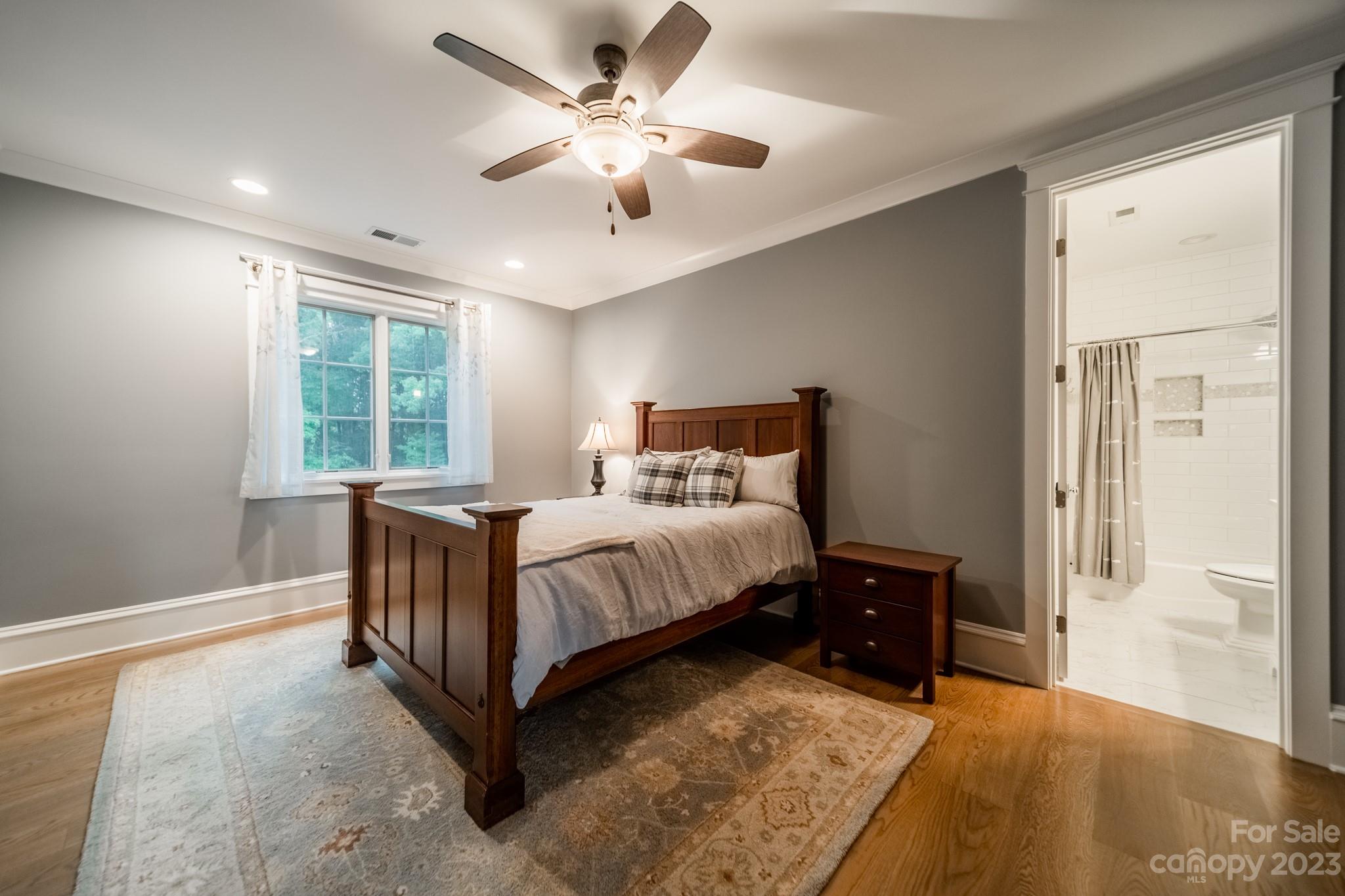 721 Lester Davis Road Waxhaw, NC 28173 - Photo 34 of 48 a spacious bedroom with a bed and a window