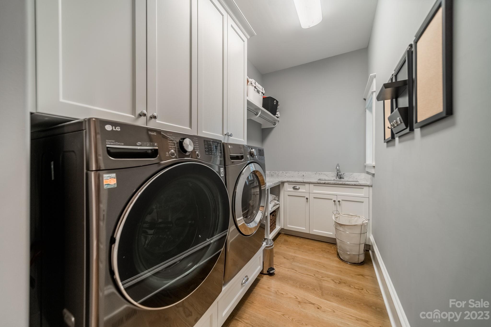 721 Lester Davis Road Waxhaw, NC 28173 - Photo 40 of 48 a utility room with sink dryer and washer