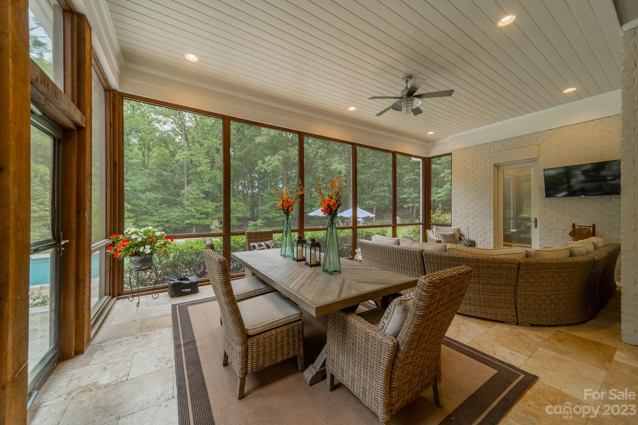 721 Lester Davis Road Waxhaw, NC 28173 - Photo 41 of 48 a dining room with furniture a chandelier and wooden floor