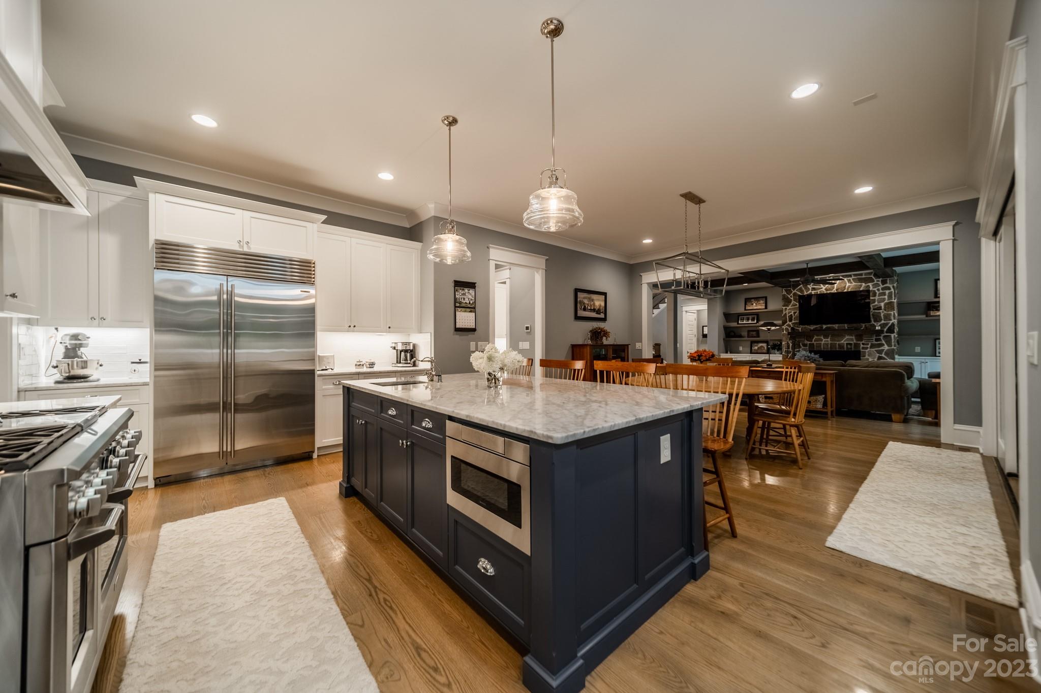721 Lester Davis Road Waxhaw, NC 28173 - Photo 5 of 48 a kitchen with stainless steel appliances granite countertop a stove and a large refrigerator