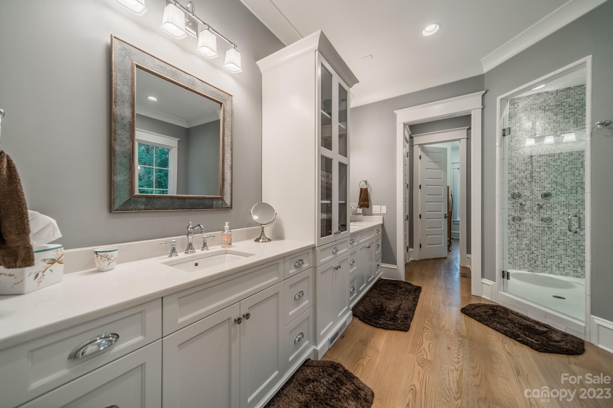 721 Lester Davis Road Waxhaw, NC 28173 - Photo 8 of 48 a bathroom with a double vanity sink mirror and shower