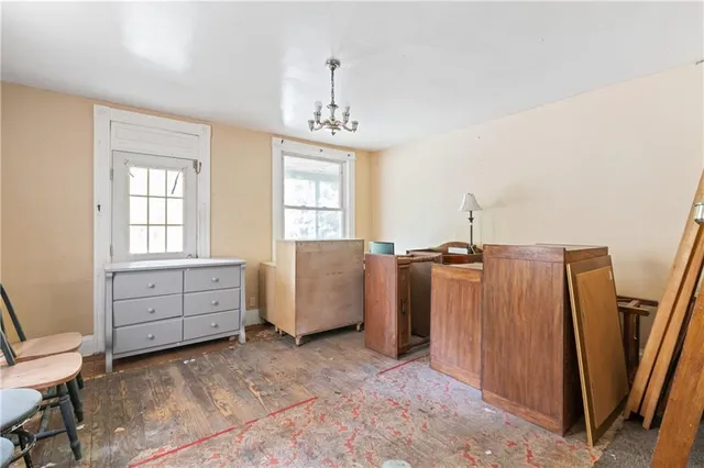 a view of a livingroom with furniture and windows