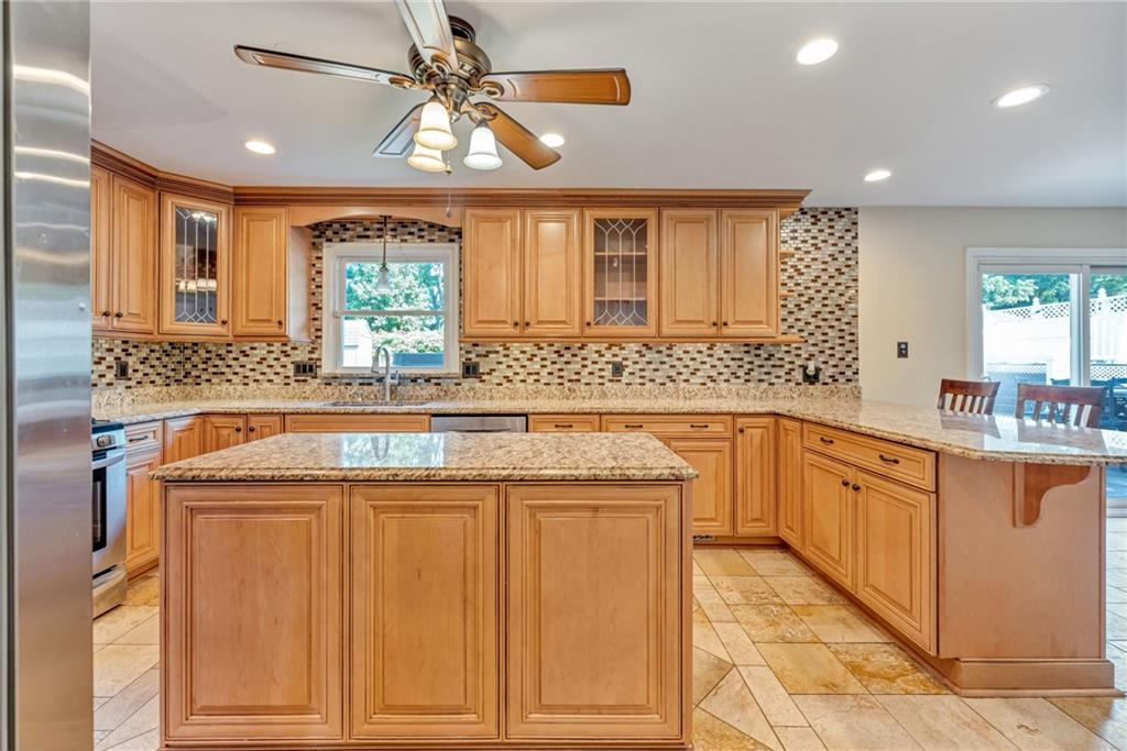 5015 Julia Lane McKees Rocks, PA 15136 - Photo 12 of 45 a kitchen with stainless steel appliances granite countertop a sink and cabinets
