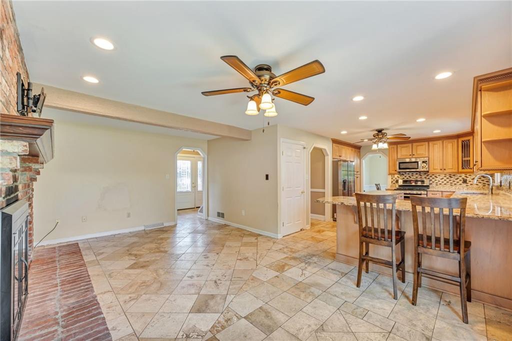 5015 Julia Lane McKees Rocks, PA 15136 - Photo 14 of 45 a view of a livingroom with furniture and a ceiling fan