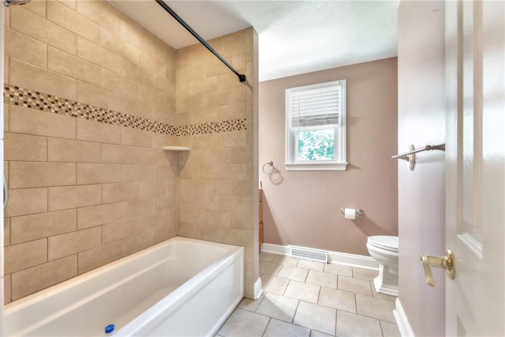 5015 Julia Lane McKees Rocks, PA 15136 - Photo 27 of 45 a bathroom with a bathtub and toilet