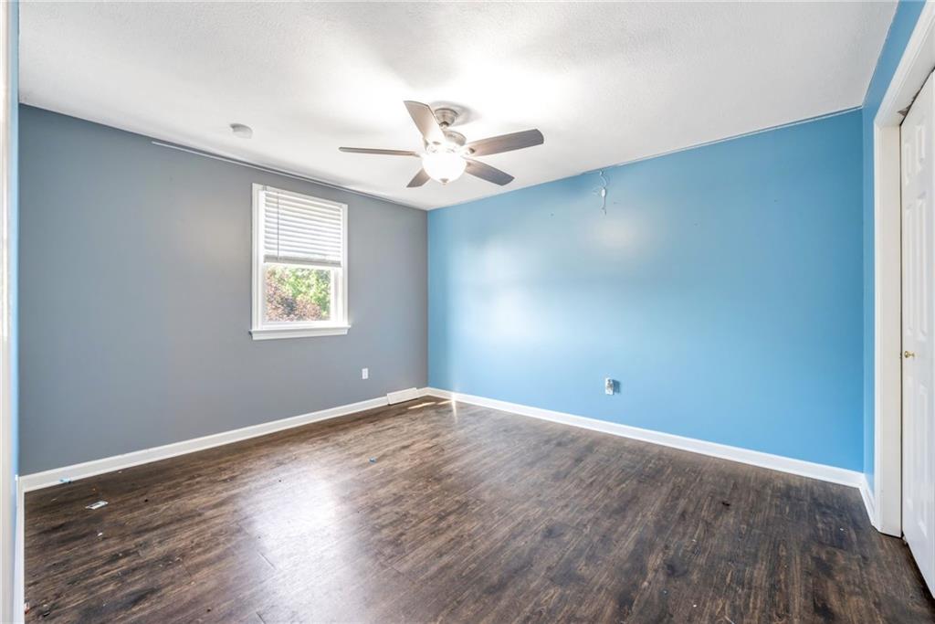 5015 Julia Lane McKees Rocks, PA 15136 - Photo 28 of 45 an empty room with wooden floor fan and windows