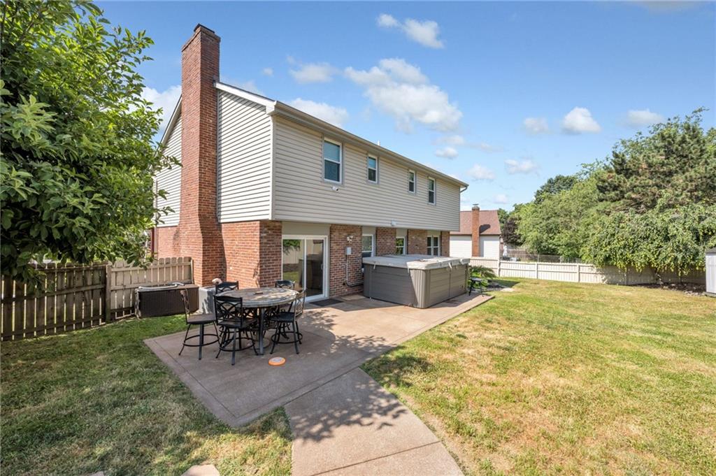 5015 Julia Lane McKees Rocks, PA 15136 - Photo 37 of 45 a view of a patio with table and chairs potted plants with wooden fence