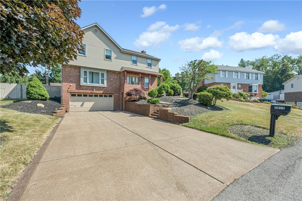 5015 Julia Lane McKees Rocks, PA 15136 - Photo 4 of 45 a front view of a house with garden