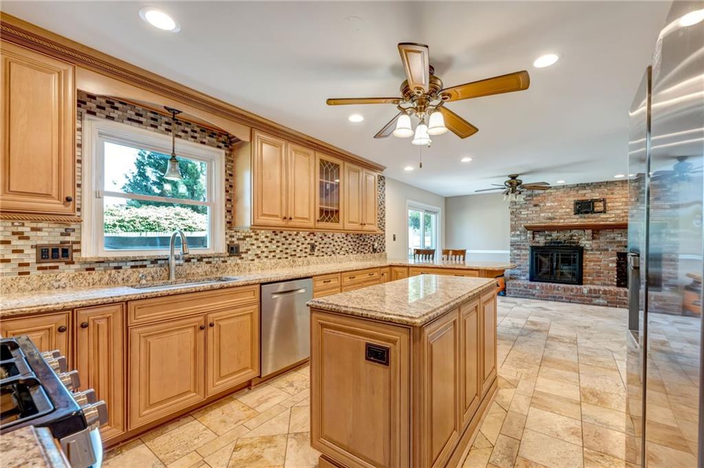 5015 Julia Lane McKees Rocks, PA 15136 - Photo 7 of 45 a kitchen with a stove a sink and a refrigerator