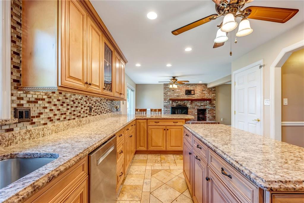 5015 Julia Lane McKees Rocks, PA 15136 - Photo 8 of 45 a large kitchen with kitchen island granite countertop a sink and counter space