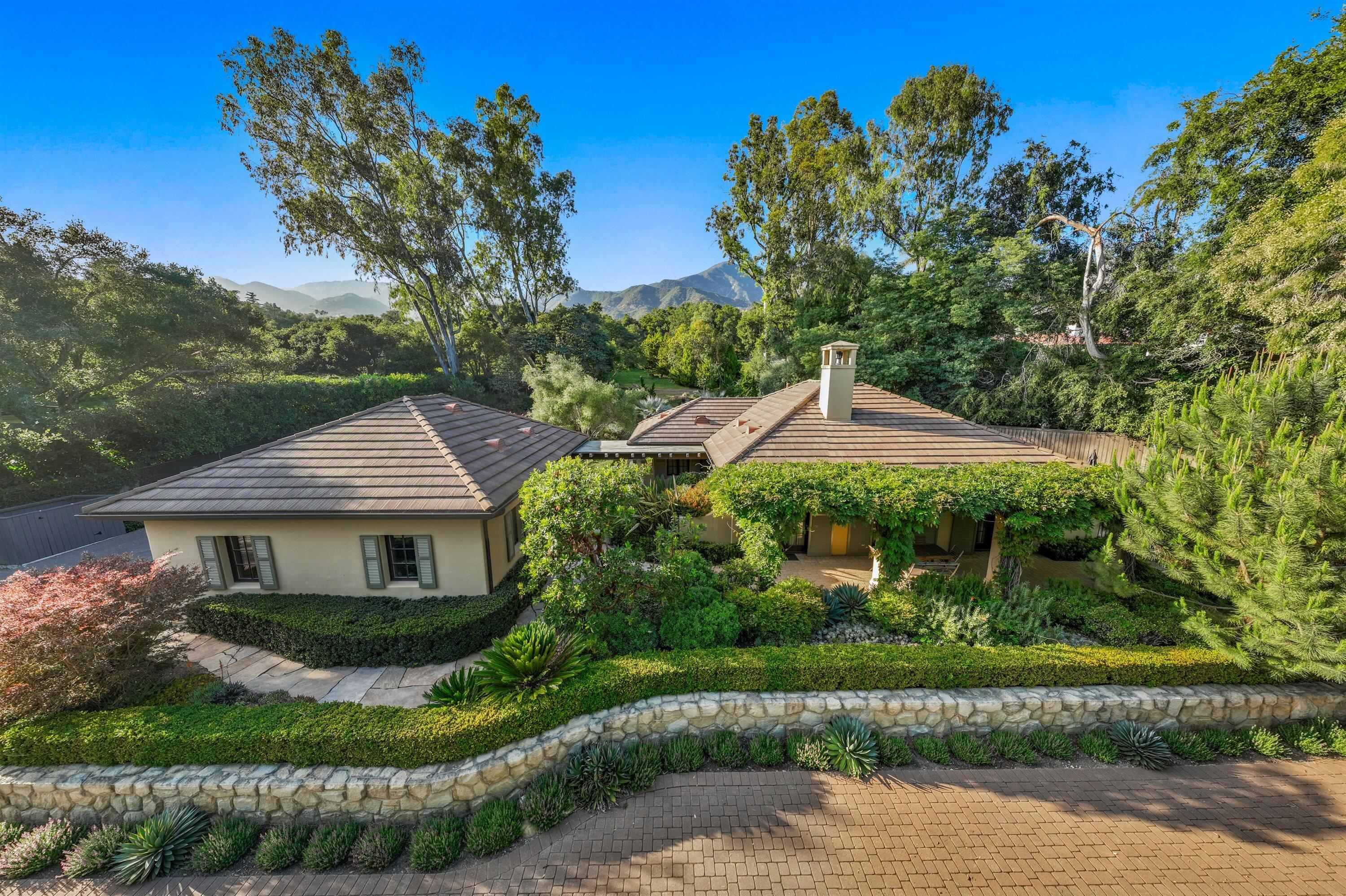 741 Hot Springs Road Santa Barbara, CA 93108 - Photo 2 of 24 a front view of a house with a yard