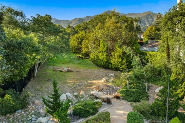 a view of a garden with a houses