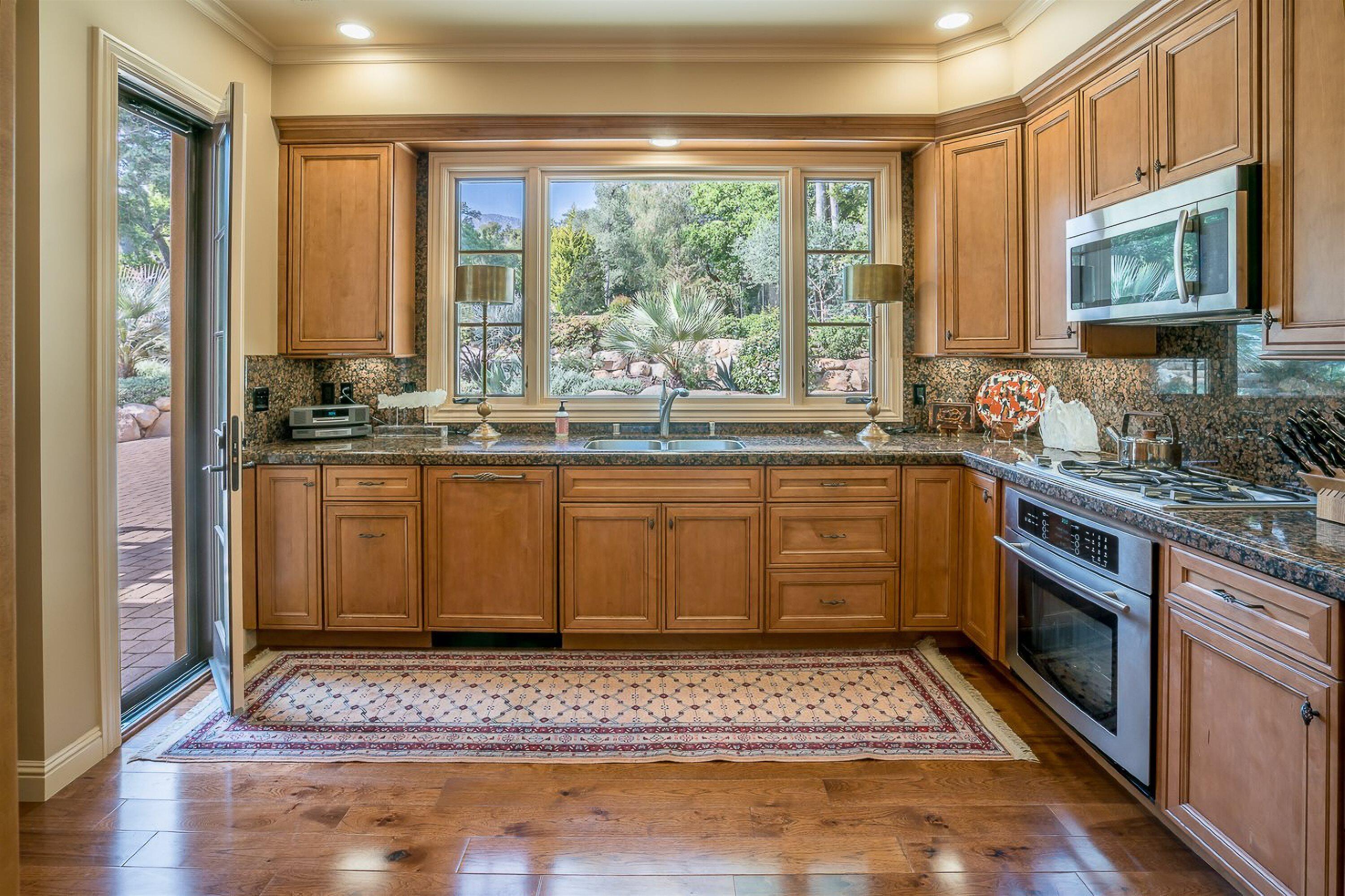 741 Hot Springs Road Santa Barbara, CA 93108 - Photo 10 of 24 a kitchen with a stove a sink and a microwave