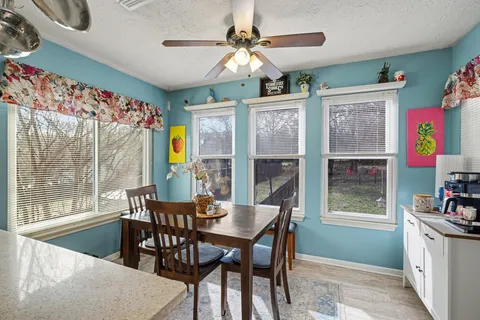 a view of a dining room with furniture window and outside view