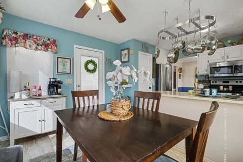 a view of a dining room with furniture