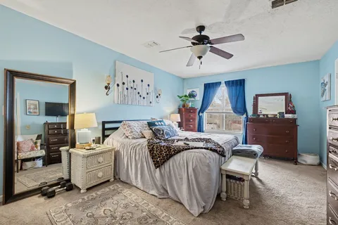 a bed room with a bed and a tv