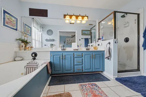a bathroom with a sink a vanity and a mirror