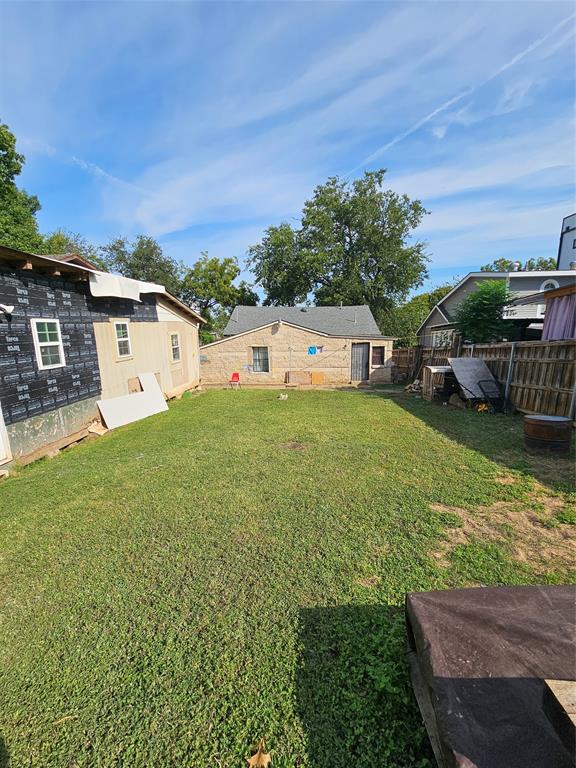 1908 Pollard Street Dallas, TX 75208 - Photo 2 of 5 a view of a house with a yard