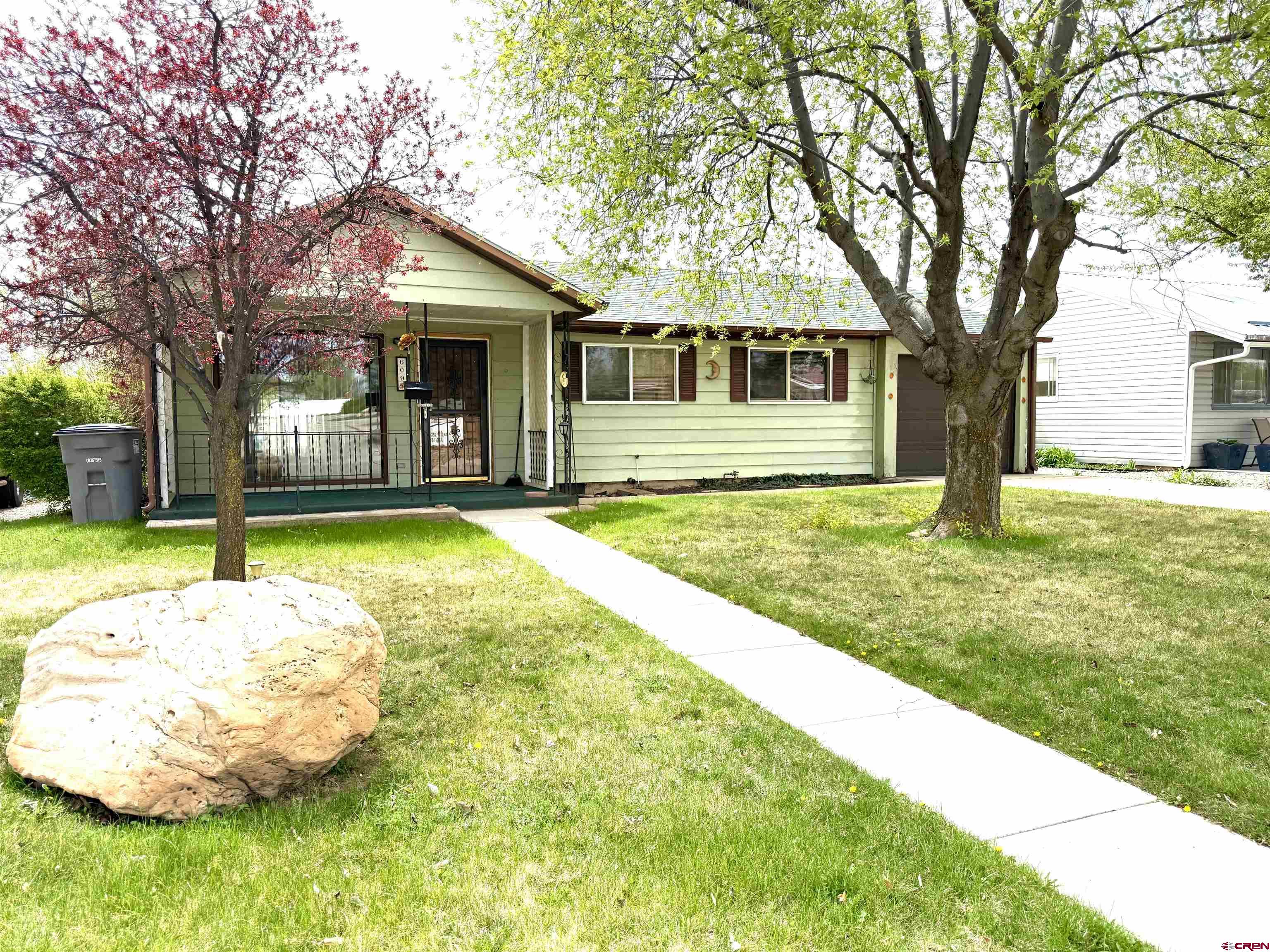 609 East 2nd Street Cortez, CO 81321 - Photo 1 of 21 a view of a house with a yard