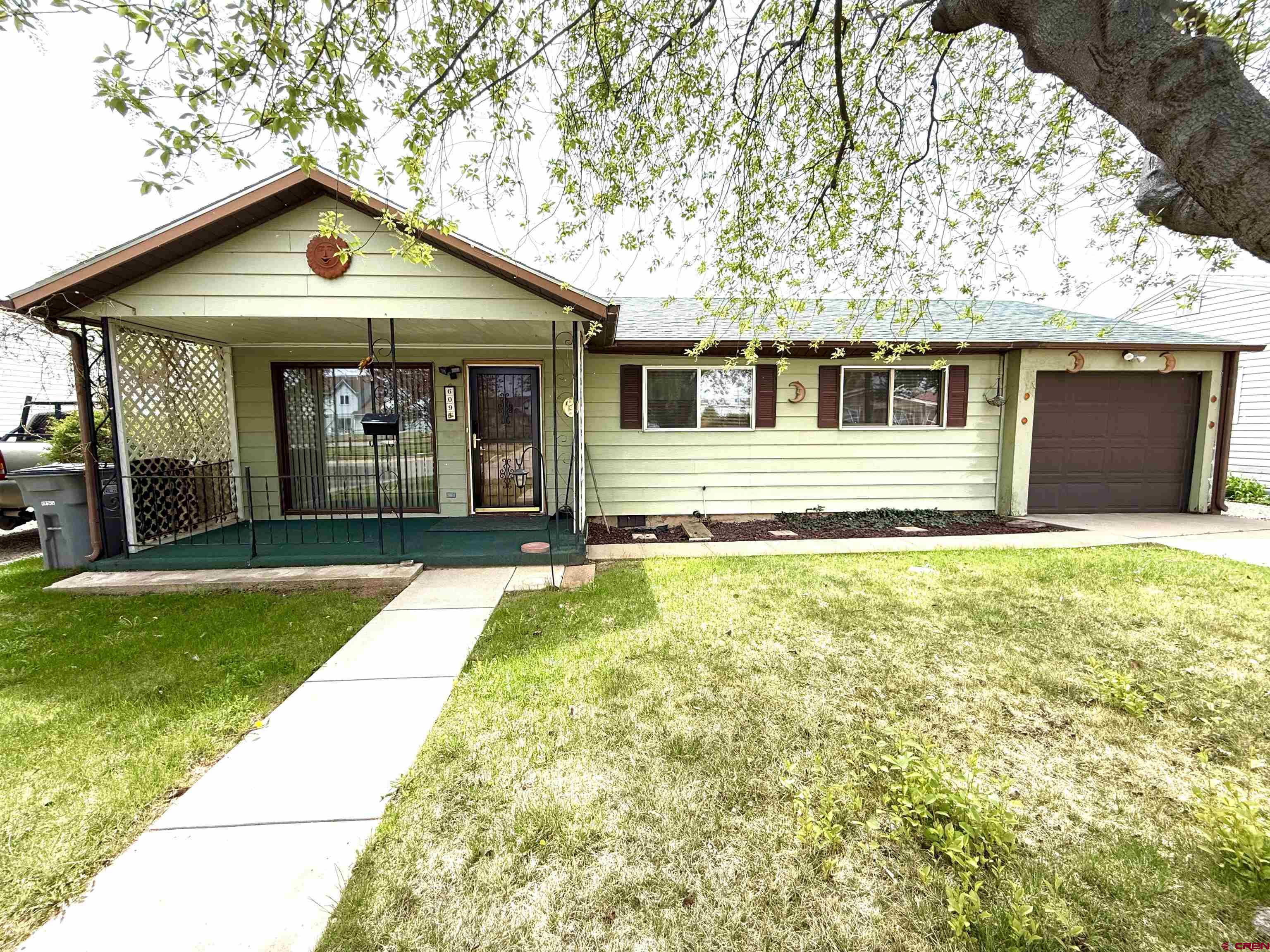 609 East 2nd Street Cortez, CO 81321 - Photo 19 of 21 a front view of a house with a yard