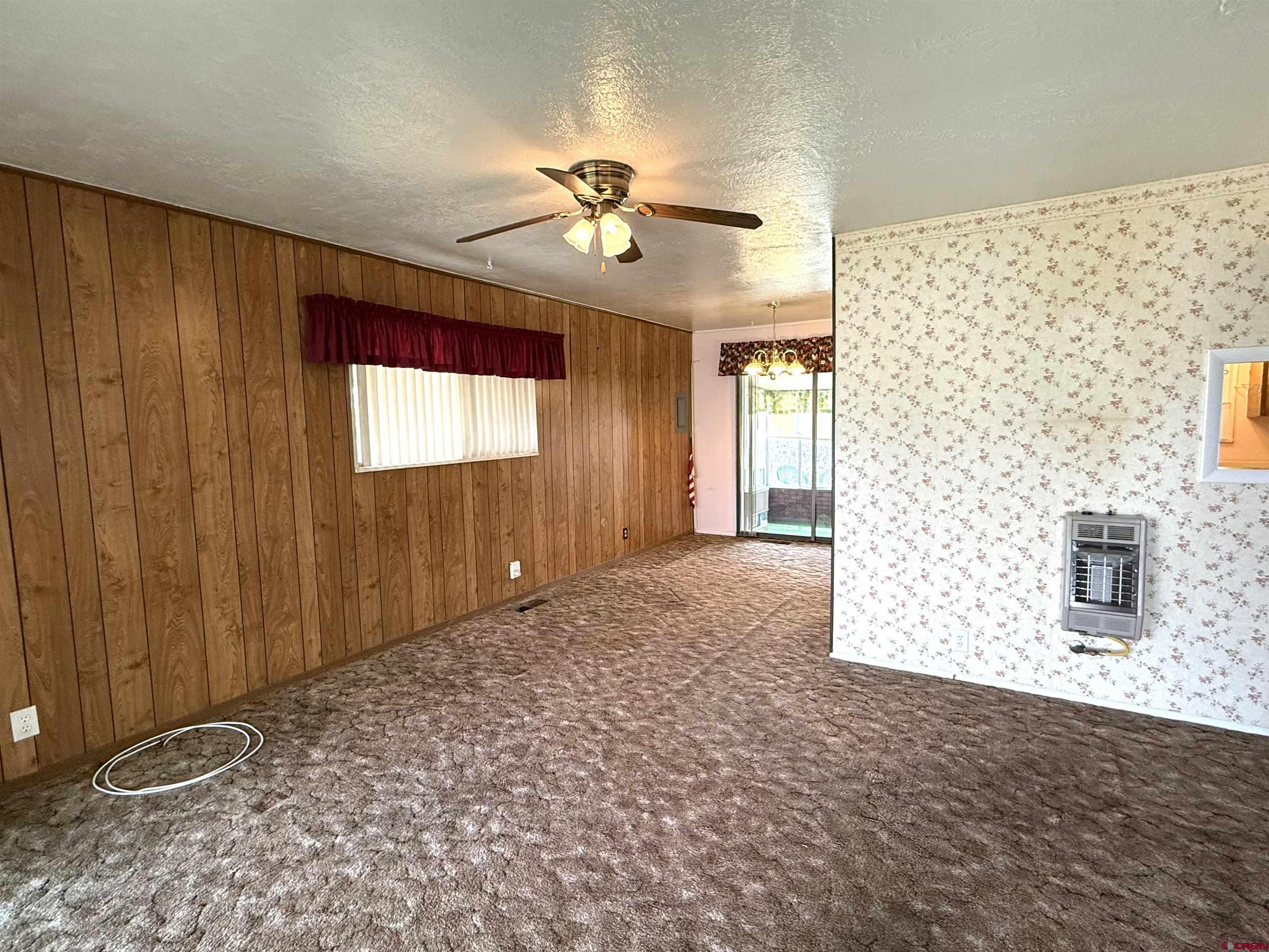 609 East 2nd Street Cortez, CO 81321 - Photo 4 of 21 a view of a livingroom with a ceiling fan and window