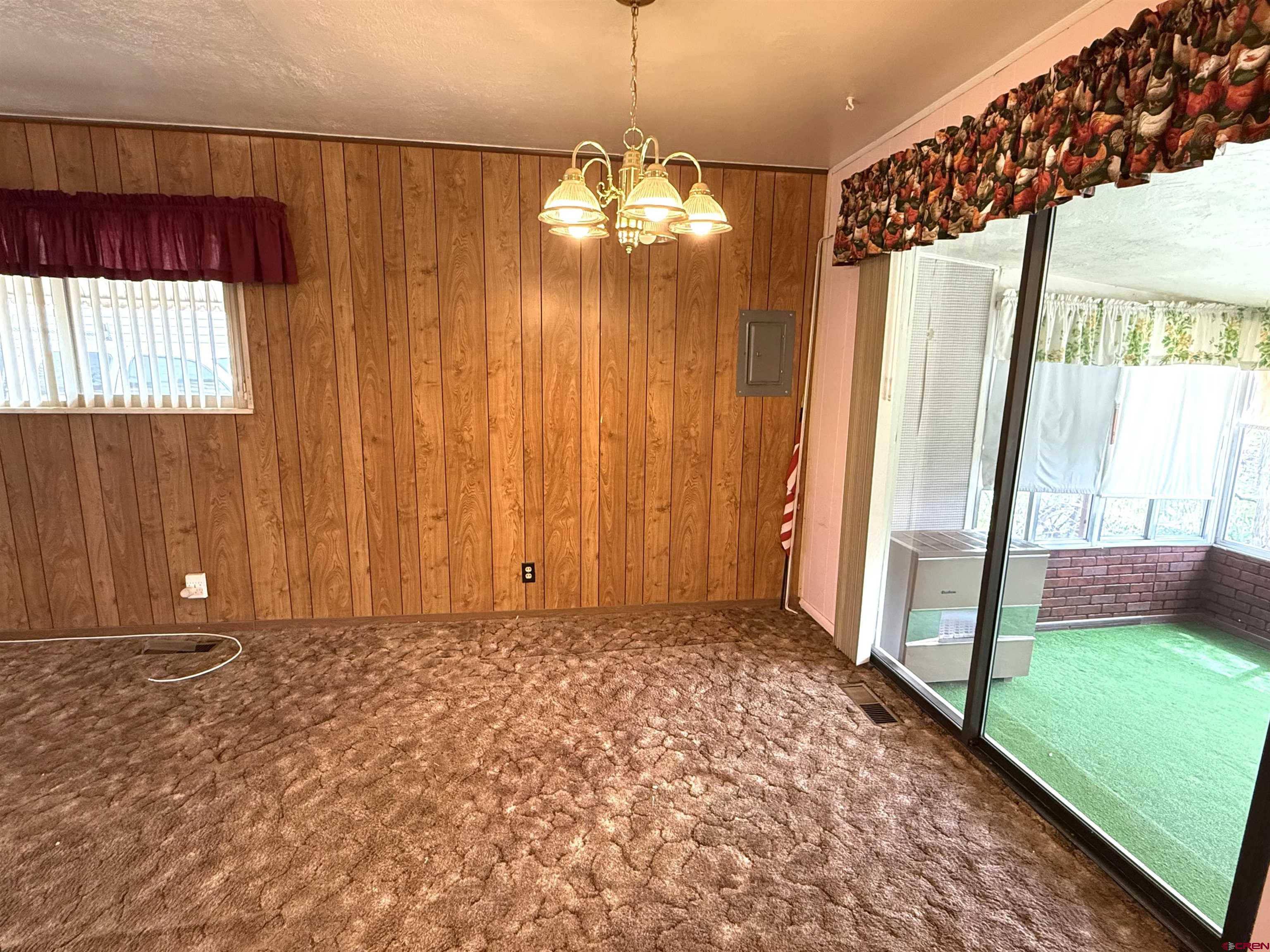 609 East 2nd Street Cortez, CO 81321 - Photo 5 of 21 a view of a room with window and front door