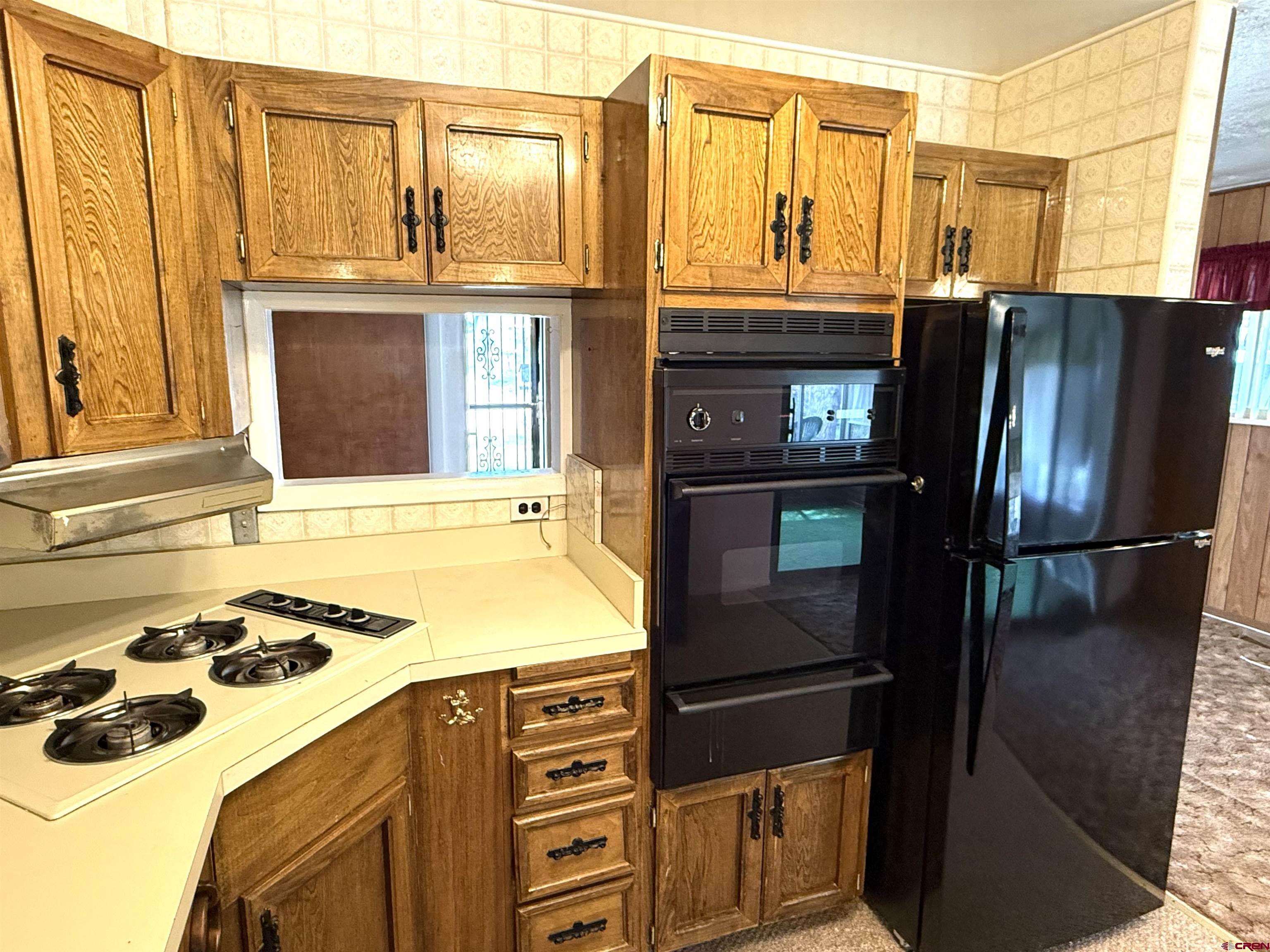 609 East 2nd Street Cortez, CO 81321 - Photo 7 of 21 a kitchen with stainless steel appliances granite countertop a refrigerator and a stove